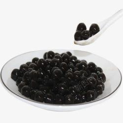 黑色珍珠豆白色勺子里从满满一碗的白瓷碗里高清图片