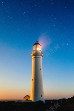 蓝色星空海边灯塔背景