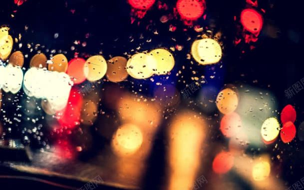 雨夜玻璃外的灯光海报背景背景
