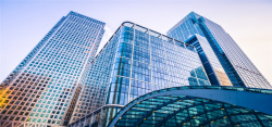 企业玻璃贴蓝色商务城市建筑大楼背景高清图片