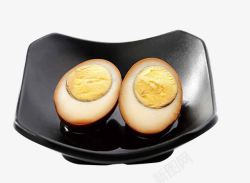 茶叶味盘子中的卤鸡蛋片高清图片