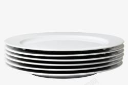 圆餐盘一叠白色瓷器餐盘高清图片