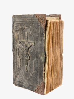 黑色带灰尘的十字架封面的旧书籍素材