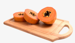 熟木瓜红色营养在砧板上被切成圆的熟木高清图片