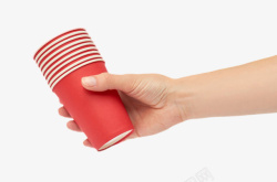 手拿着一叠红色水杯实物素材