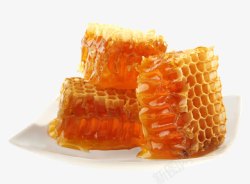 玻璃瓶中的蜂蜜盘子中的蜂巢高清图片