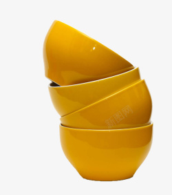 一叠盘子黄色堆叠餐具小瓷碗高清图片