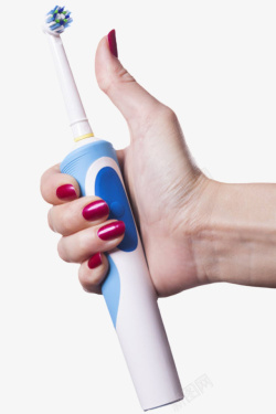 清洁用具手拿着蓝色电动牙刷实物高清图片