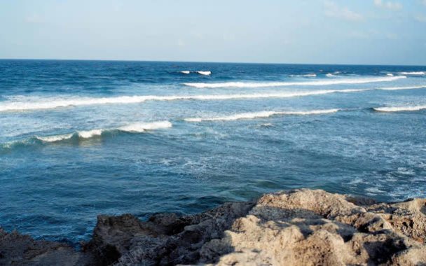 海水海波岩石蓝色背景