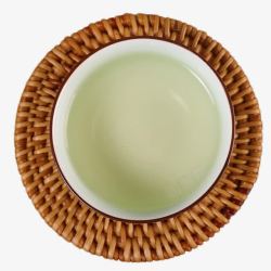 茶杯垫茶杯中的西湖龙井茶高清图片