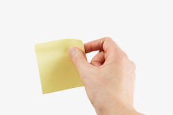 手捏着黄色空白的便利贴便笺纸实素材