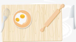 卡通砧板砧板上的鸡蛋和擀面杖高清图片