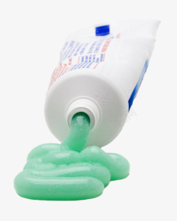 白色塑料包装牙膏管和绿色物体实素材