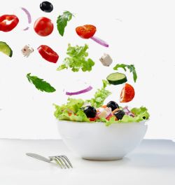 蔬菜飞起来一碗蔬菜叉子飞起来的西红柿辣椒高清图片