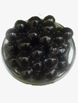 透明玻璃杯里满满的黑色珍珠豆俯素材