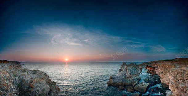 太阳日出海面岩石背景