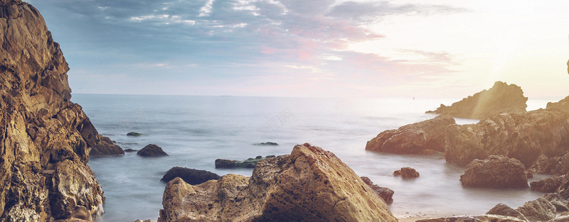 海景天空石头夕阳摄影图片