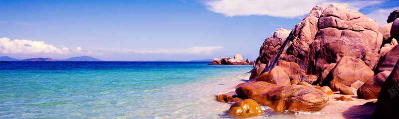 海边礁石沙滩风景背景摄影图片