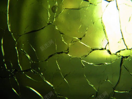 绿色玻璃上的裂痕背景