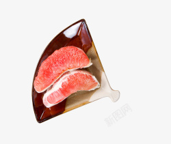 瓷碟子扇形瓷碟里的柚子高清图片