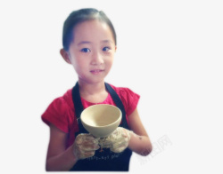 小女孩手中的手工陶瓷碗素材