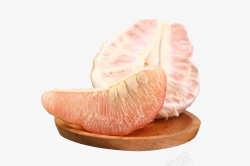 柚肉木盘子里的红肉柚子高清图片