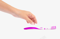 准备用手去拿紫色牙刷实物素材