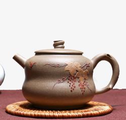杯垫上的葫芦形茶壶素材