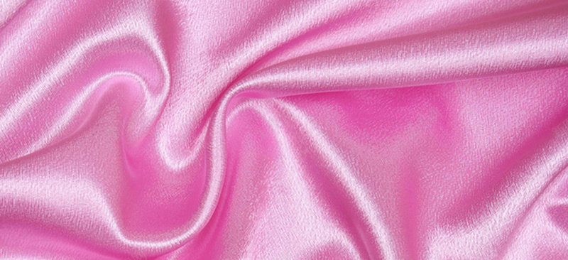 粉色质感褶皱丝绸珠宝背景背景