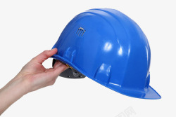 工业塑料手拿蓝色头盔高清图片
