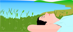 草地上躺着插图躺在湖边草地上的人高清图片