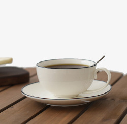 木桌上的咖啡杯子素材