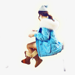 黄色雪地靴身穿蓝色大衣看书的女孩高清图片