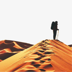 金色沙一步一个脚印走在沙漠里的人高清图片