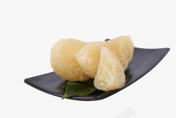 柚肉黑色盘子里的白色柚子肉高清图片
