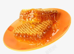 玻璃瓶中的蜂蜜盘子中的蜂巢高清图片