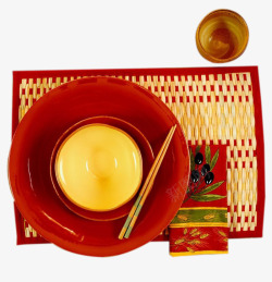红色碗内的筷子和黄色美食素材