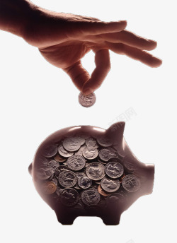 硬币罐把硬币放进储钱罐高清图片