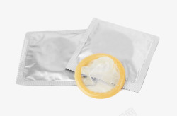 银色包装里的黄色避孕套实物素材
