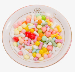 白色瓷碗里的彩色糖豆素材