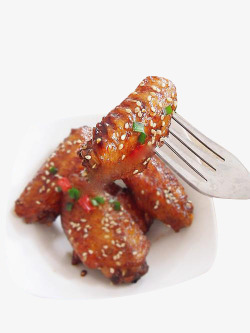 韩国烤肉叉子叉起的鸡翅高清图片