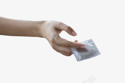 银色性保健品手指夹着的避孕套橡素材